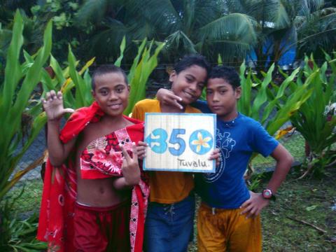Children in Tuvalu holding a sign